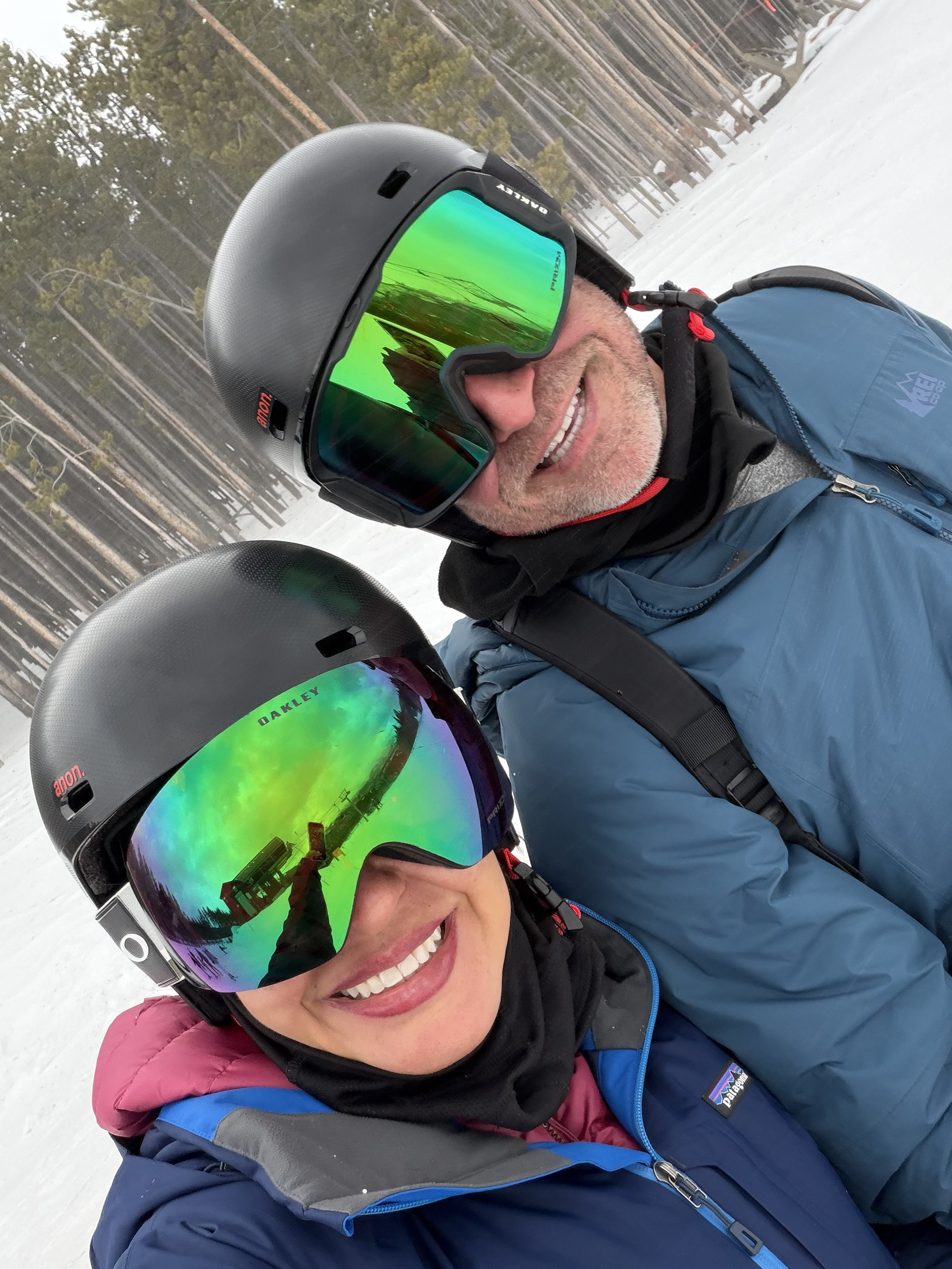 Two people smiling in ski gear